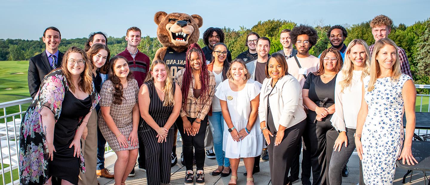 group photo of young adults in business professional attire